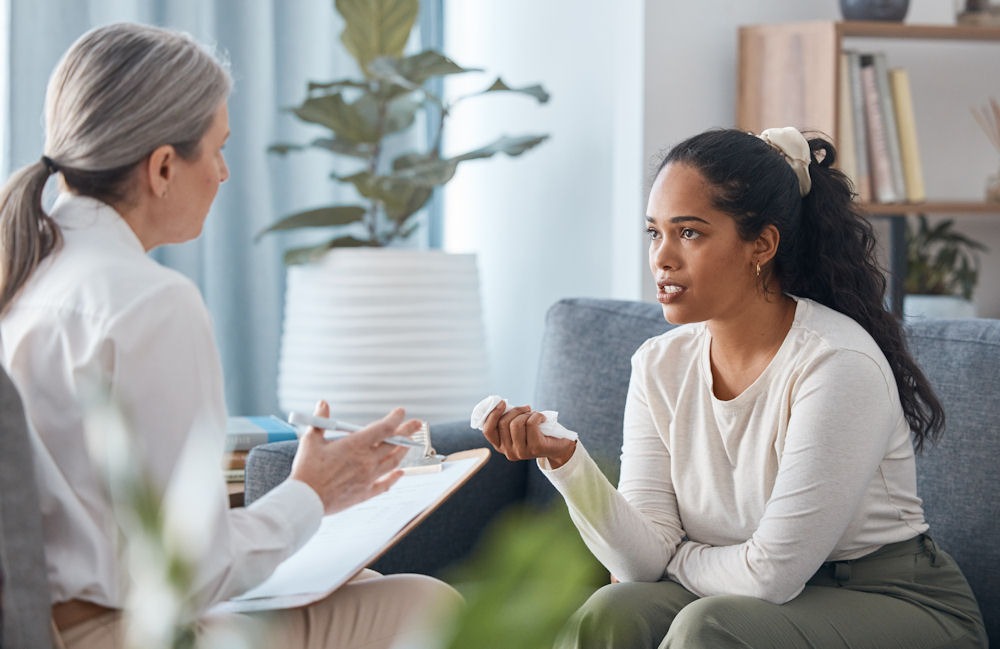 therapist sitting with female client in individual therapy