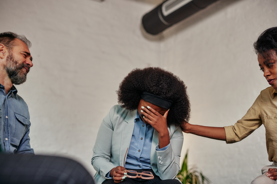 Upset woman covering her face