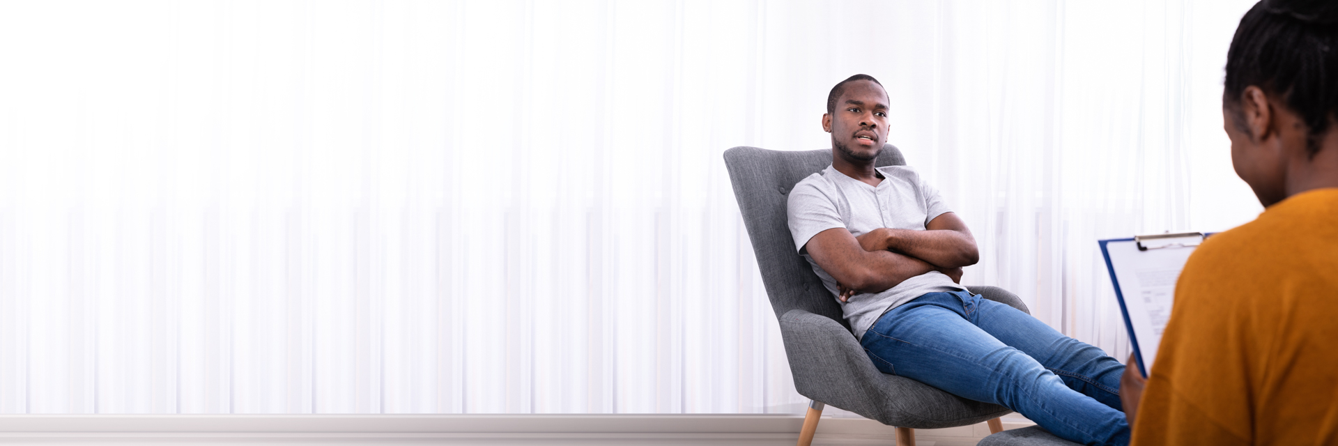 man sitting in chair in doctors office