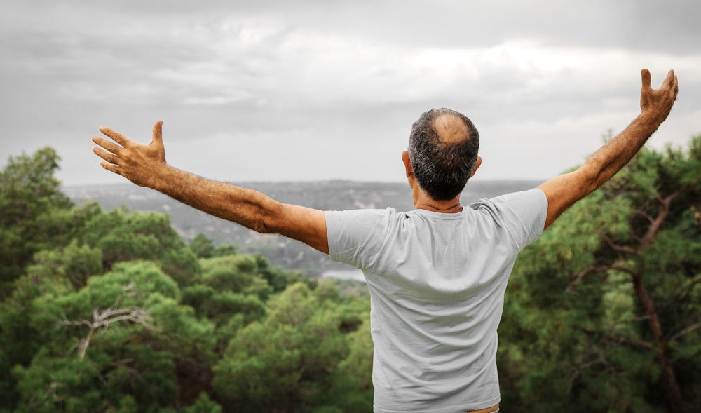 man outside enjoying nature