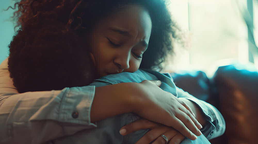 mother embracing son during therapy