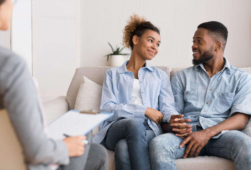 couple holding hands in therapy